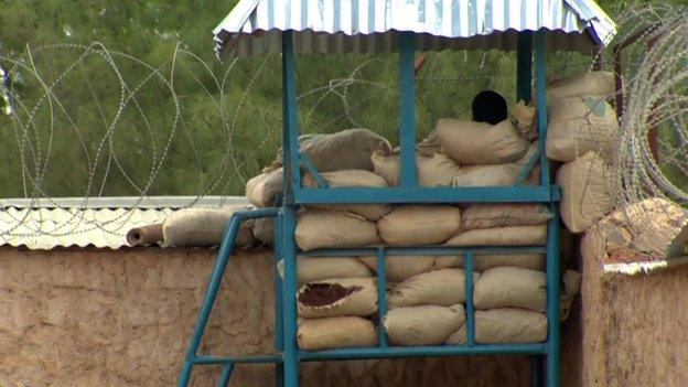 A guard stands watch at a camp in Somalia