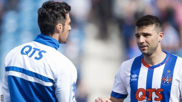 Alexei Eremenko (right) shakes hands with Kilmarnock team-mate Manuel Pascali at full-time.