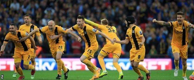 Southend United players celebrate winning the penalty shootout