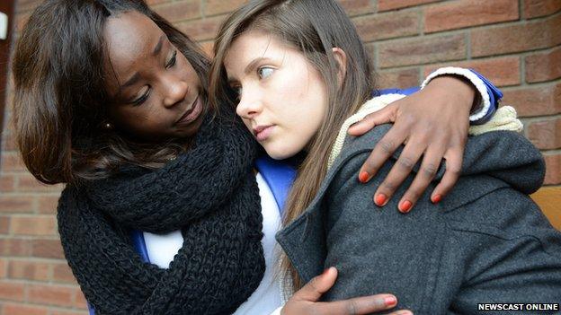 Young woman being comforted