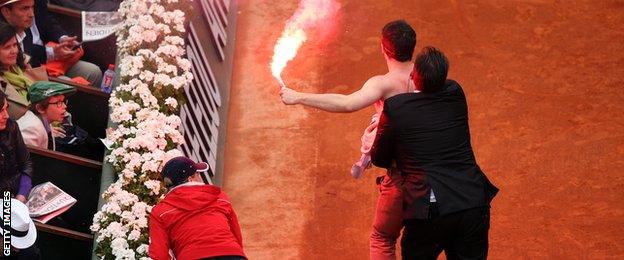 A protestor ran onto centre court with a flare during the 2013 French Open final