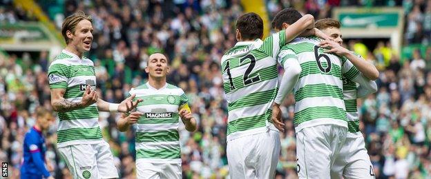 Stefan Johansen (left) celebrates with his Celtic team-mates