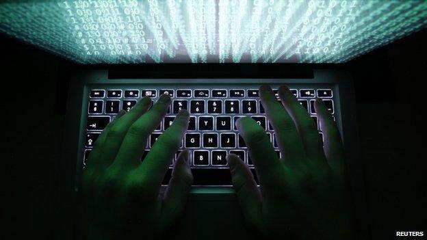 A man types on a computer keyboard in Warsaw February 28, 2013