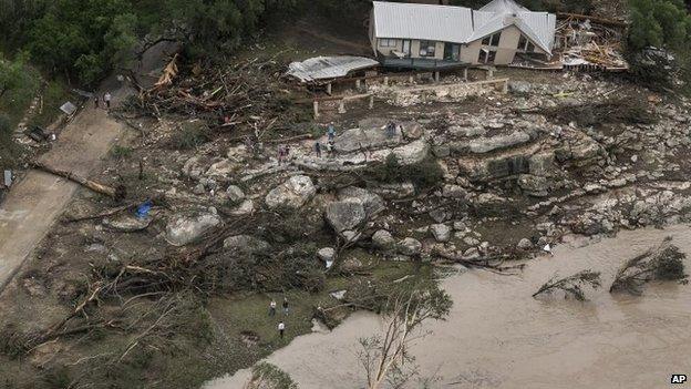 This aerial photo shows a home along the Blanco River that was taken off its foundation after rain caused flash flooding in Wimberley, Texas, Sunday, 24 May 2015.