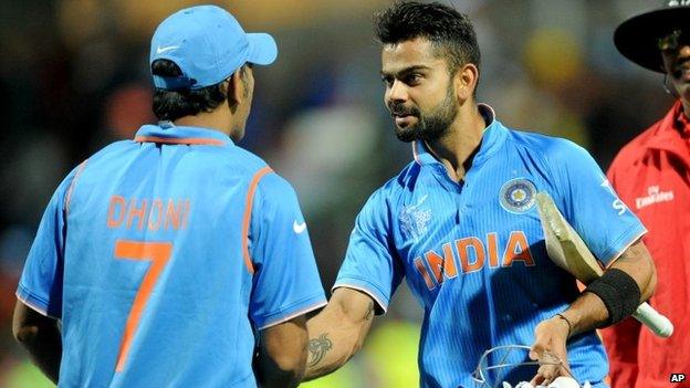 India's Virat Kohli, right, is congratulated by his captain MS Dhoni after they defeated Ireland by eight wickets in their Cricket World Cup Pool B match in Hamilton, New Zealand, Tuesday, March 10, 2015.