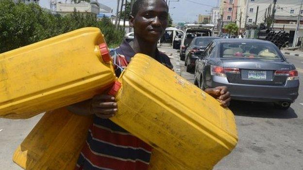 Man with jerry cans