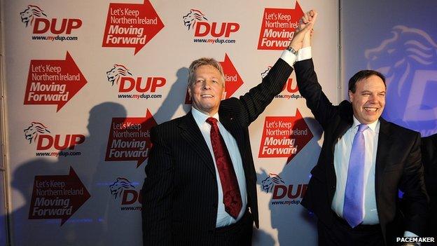 Peter Robinson with DUP deputy leader Nigel Dodds takes applause of party members as he delivered his speech to the annual DUP party conference in 2011