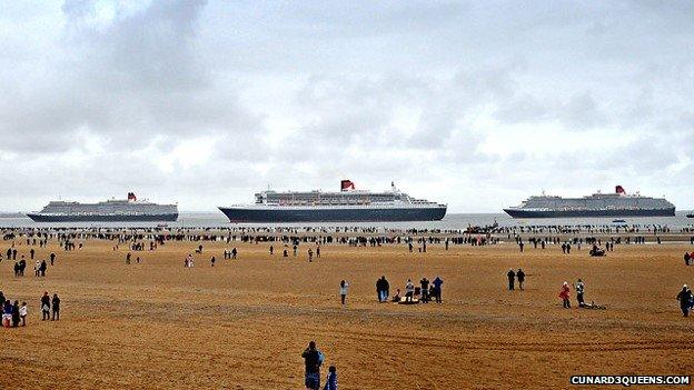 Queen Elizabeth, Queen Mary 2 off Crosby Beach ready to enter the River Mersey