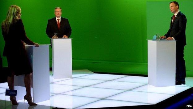 President Komorowski (centre) and his rival Andrzej Duda take part in a debate chaired by TVN presenter Justin Pochanke in Warsaw, Poland - 21 May 2015