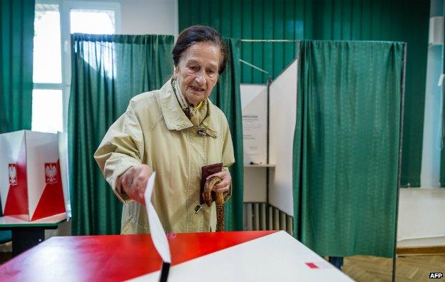 A woman casts her ballot during the second round of the presidential election in Warsaw - 24 May 2015