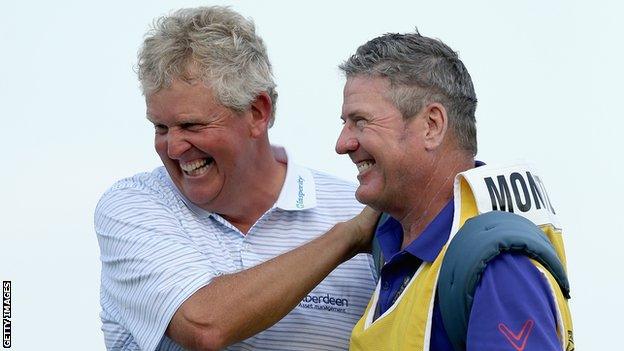 Colin Montgomerie (left) and his caddie Alastair McLean celebrate after winning the Senior PGA Championship