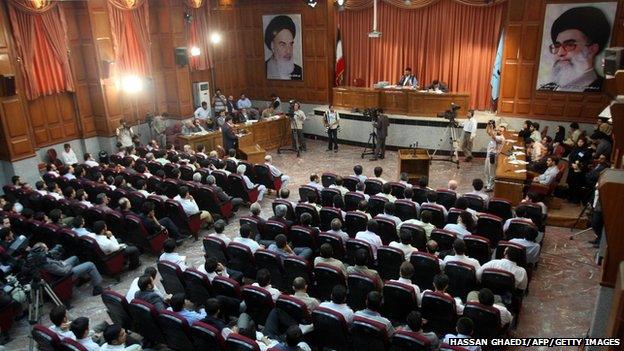 A general view of a courtroom shows suspected opposition supporters (in grey) attending the latest session in their trial at the revolutionary court in Tehran on 25 August 2009.