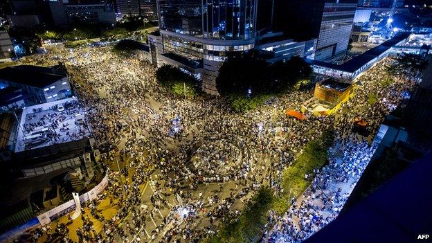 Protestors and student demonstrators gather during a demonstration outside headquarters of the Legislative Counsel on 28 September 2014 in Hong Kong