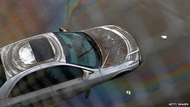 Car in floodwaters nearby Houston