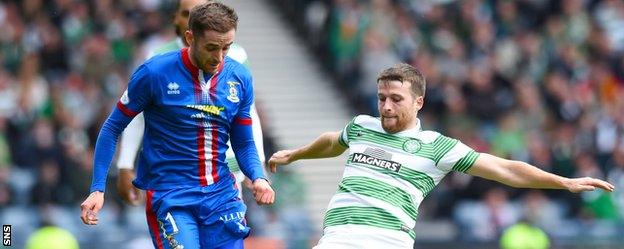 Nick Ross is tackled by Celtic's Adam Matthews