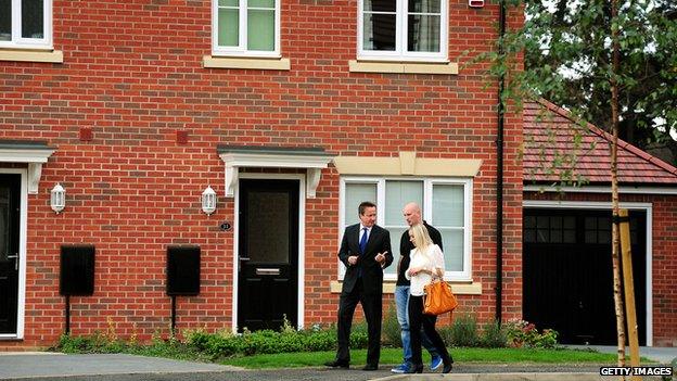 Cameron and couple on estate