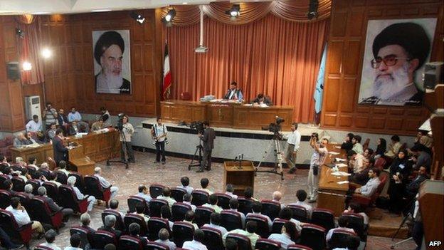 A general view of a courtroom shows suspected opposition supporters (in grey) attending the latest session in their trial at the revolutionary court in Tehran 25 August 2009.