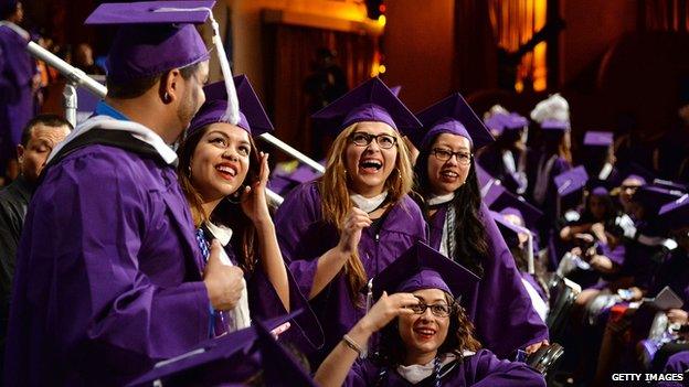 Graduates celebrate at Hunter College commencement ceremonies.