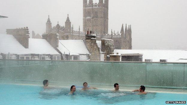 People enjoy a thermal spa in the UK city of Bath