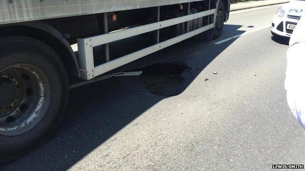 Sinkhole underneath lorry