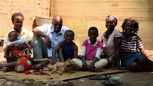 Family sitting with dog