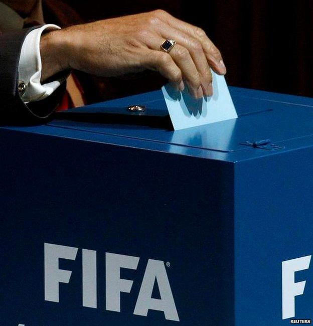 A delegate places his vote into the ballot box for the presidential election, on June 1, 2011 during the 61st FIFA congress at the Zurich Hallenstadion in Zuric