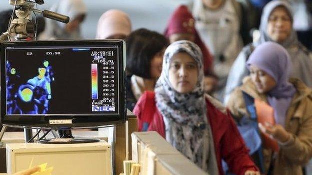 A thermal camera monitor shows the body temperature of passengers arriving from overseas against possible MERS, Middle East Respiratory Syndrome, virus at the Incheon International Airport in South Korea Thursday, 21 May 2015.