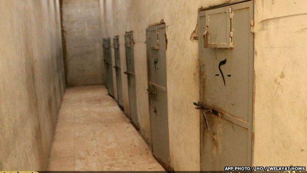 An image grab taken from a video made available by Jihadist media outlet Welayat Homs on 28 May 2015 allegedly shows the holding cells in Tadmur's notorious prison.