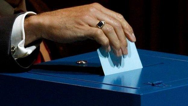 A delegate places his vote into the ballot box for the presidential election, on June 1, 2011 during the 61st FIFA congress at the Zurich Hallenstadion in Zuric