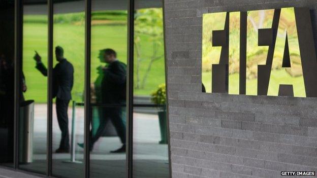 A Fifa logo sits next to the entrance to the organisation's headquarters on 27 May 2015 in Zurich, Switzerland