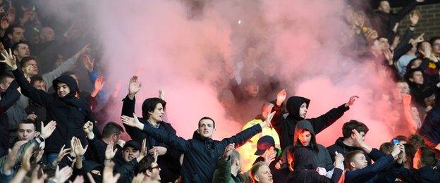 Motherwell supporters lit flares early into the game