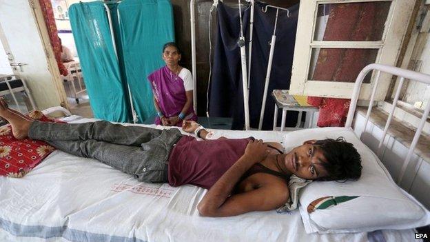 Dhanraj, 17, gets medical treatment in Jai Prakash Narayan hospital after suffering sunstroke and severe dehydration in Bhopal Madhya Pradesh, India, 27 May 2015.