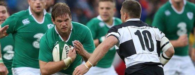 Chris Henry comes up against Barbarians fly-half Jimmy Gopperth