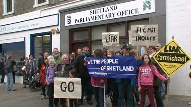 There have been protests in Mr Carmichael's constituency