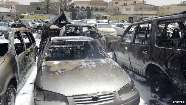 Damaged cars are seen after a car exploded near a Shia mosque in Saudi Arabia's Dammam 29 May 2015.