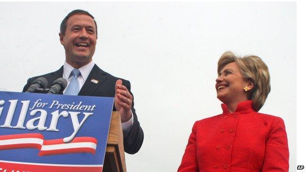 Former Secretary of State Hillary Clinton stands next to Martin O'Malley