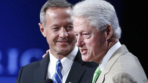 Bill Clinton stands next to Martin O'Malley