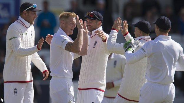 England celebrate a wicket by Ben Stokes (second left)