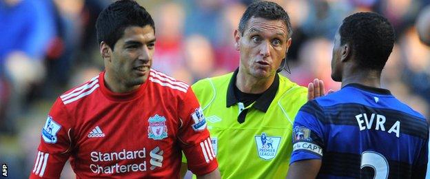 Luis Suarez and Patrice Evra