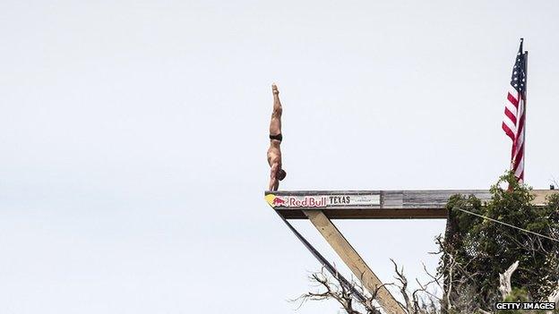 Artem Silchenko of Russia prepares to dive from the 27 metre platform