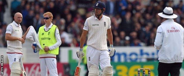 Alastair Cook walks off