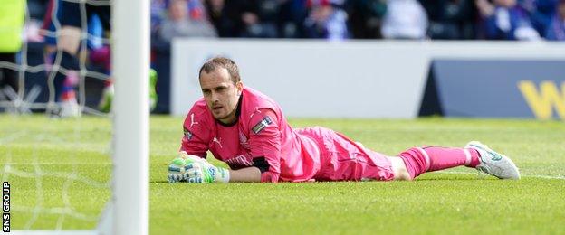 Jamie MacDonald looks on as he is beaten for a second time at Hampden