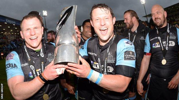 Glasgow Warriors' Chris Fusaro (left) and Peter Horne lift the Pro12 trophy