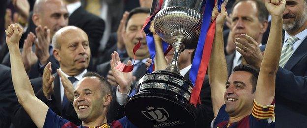 Xavi lifts the Copa Del Rey with Andres Iniesta