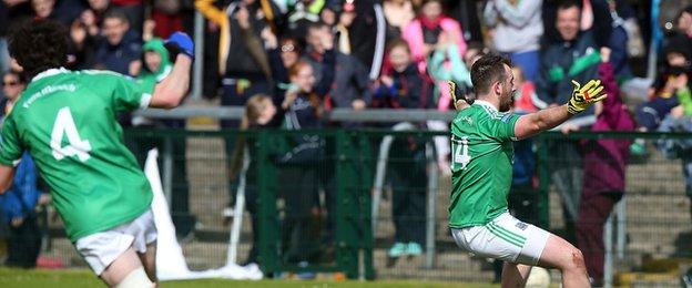 Sean Quigley celebrates his late penalty in front of Fermanagh fans at Brewster Park