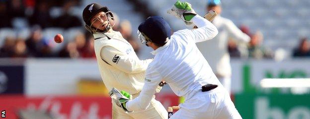 Jos Buttler (right) fails to collect a catch off BJ Watling