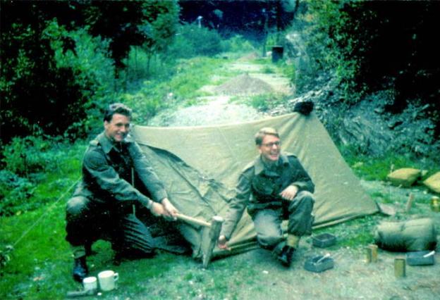 Vaughan and friend assembling a tent