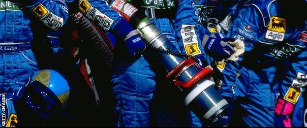 1999: The Benetton pits crew stand ready to refuel the Benetton racing car during the Brazilian Grand Prix in Sao Paulo, Brazil