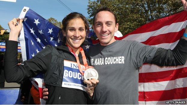 Kara and Adam Goucher with her medal after her third place finish at the New York marathon in 2008