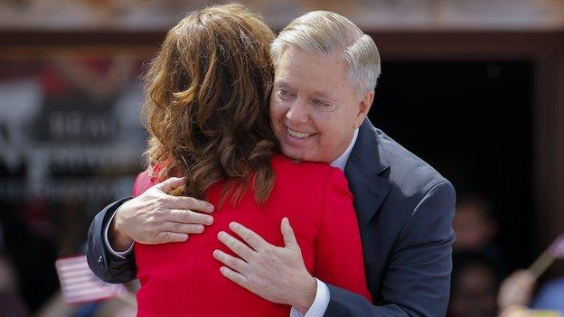 Mr Graham hugs his sister Darline Graham Nordone, who introudced him on Monday